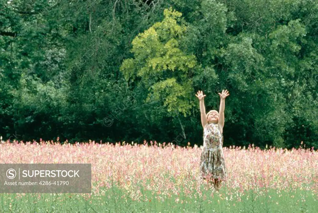 Girl playing in field