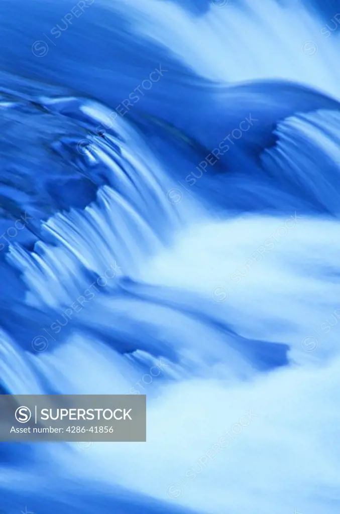 Time exposure water flowing over rocks 