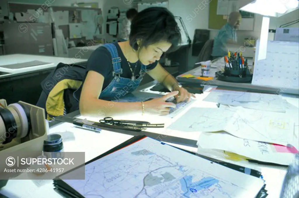 cartographer Asian woman working on street map