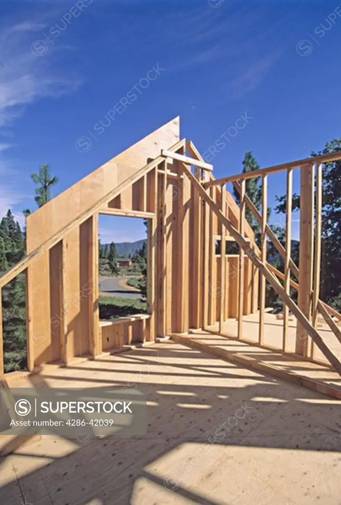 end of new house framed at construction site