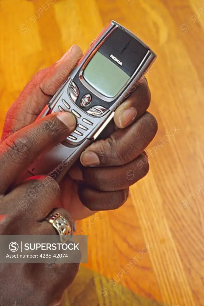 cell phone in hands of African American man