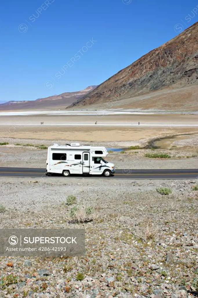 RV passing people at Badwater in Death Valley National Park California
