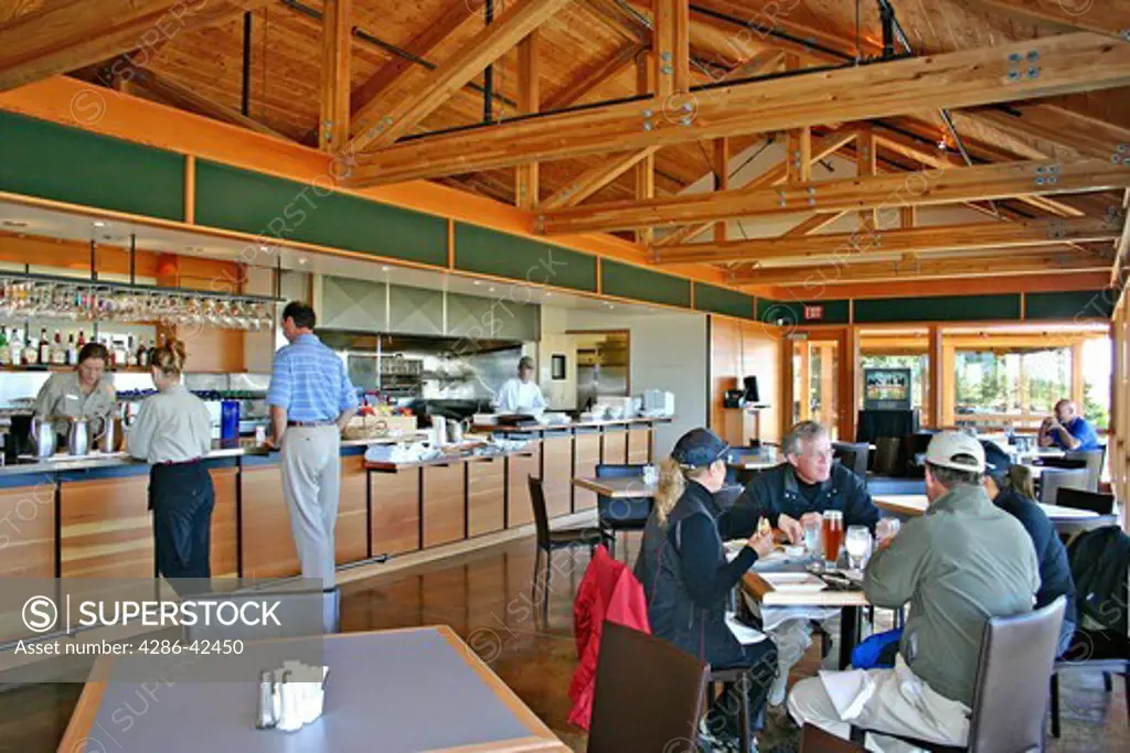 Golfers relaxing in Trails End Clubhouse restaurant at Bandon Trails Golf Course in Bandon Dunes Golf Resort Bandon Oregon