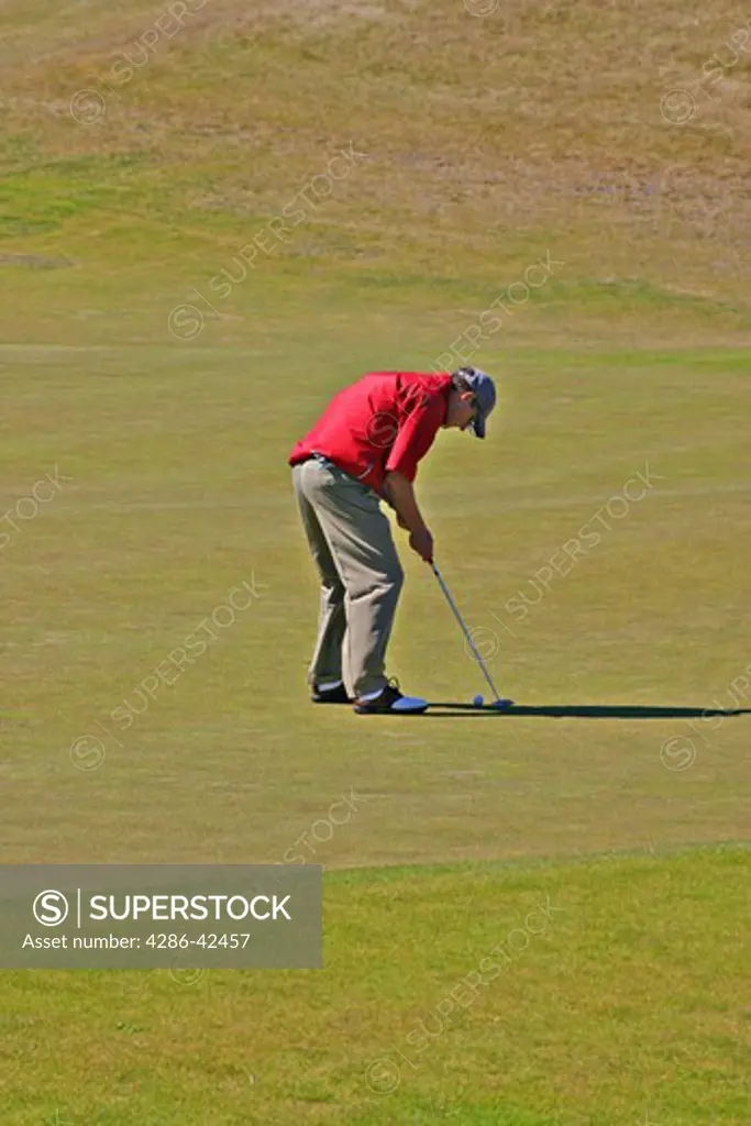 Man putting at Bandon Dunes Golf Resort Bandon Oregon