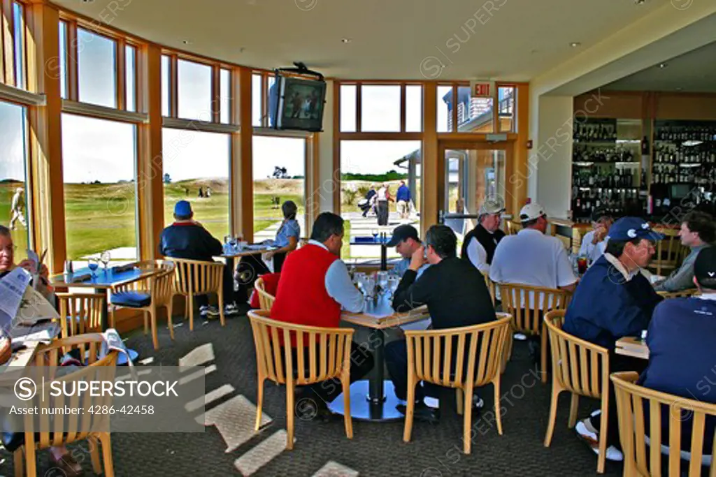 Golfers relaxing in restaurant at The Lodge at Bandon Dunes Golf Resort Bandon Oreg
