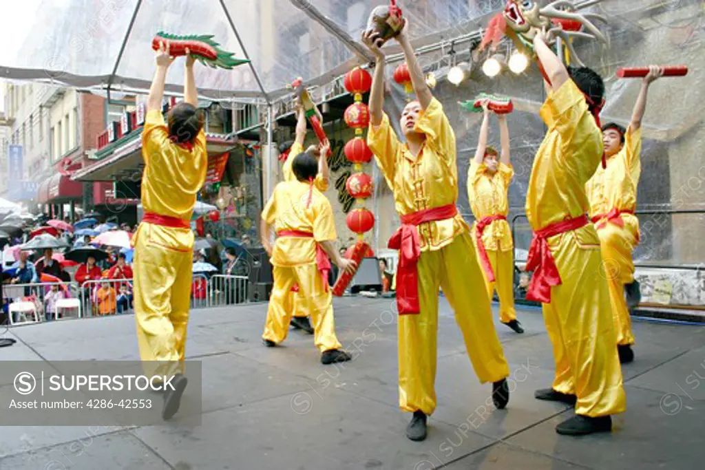Traditional Chinese dancers performance at Chinatown street fair during Chinese New Year parade weekend San Francisco California