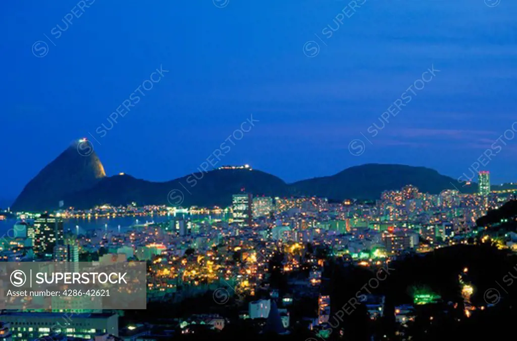 The lights of Rio de Janeiro and Sugarloaf at dusk.
