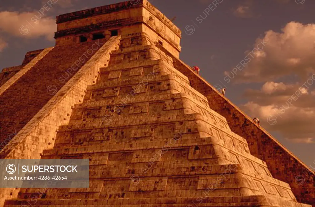 View looking up at El Castillo, the centerpiece of the Mayan ruins of Chichen-Itza, Yucatan, Mexico.