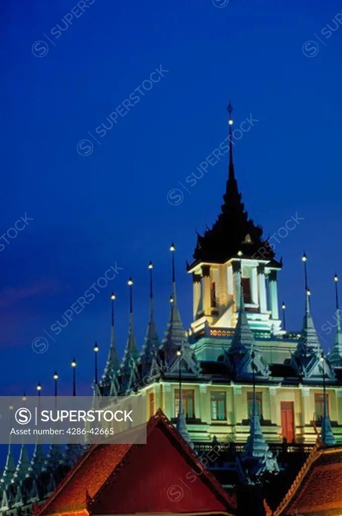 Wat Mahanopharam illuminated at night in Bangkok, Thailand.