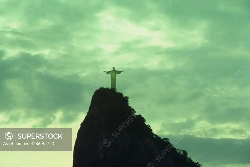 Distant view of Christ the Redeemer statue at Corcovado on Sugarloaf Mountain in Rio de Janeiro, Brazil. 