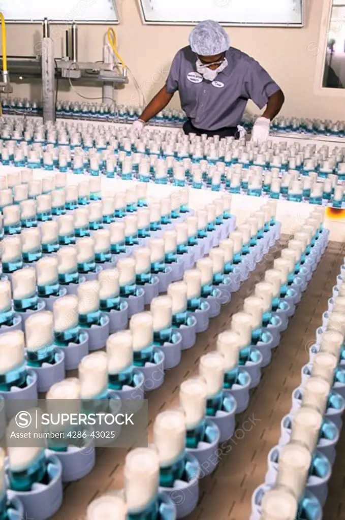Lab technician working inside a pharmaceutical factory in North Carolina.