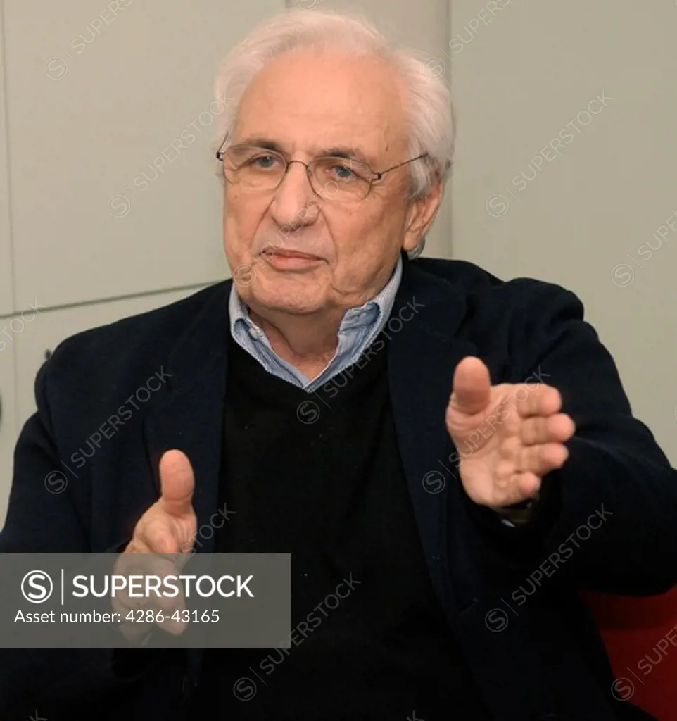 Close-up portrait of Frank Gehry, an architect in the midst of a discussion in New York.