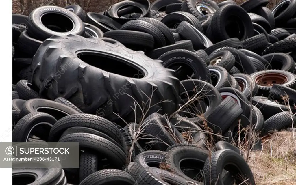 Old tires dumped on the side of the road, Oneonta, NY.