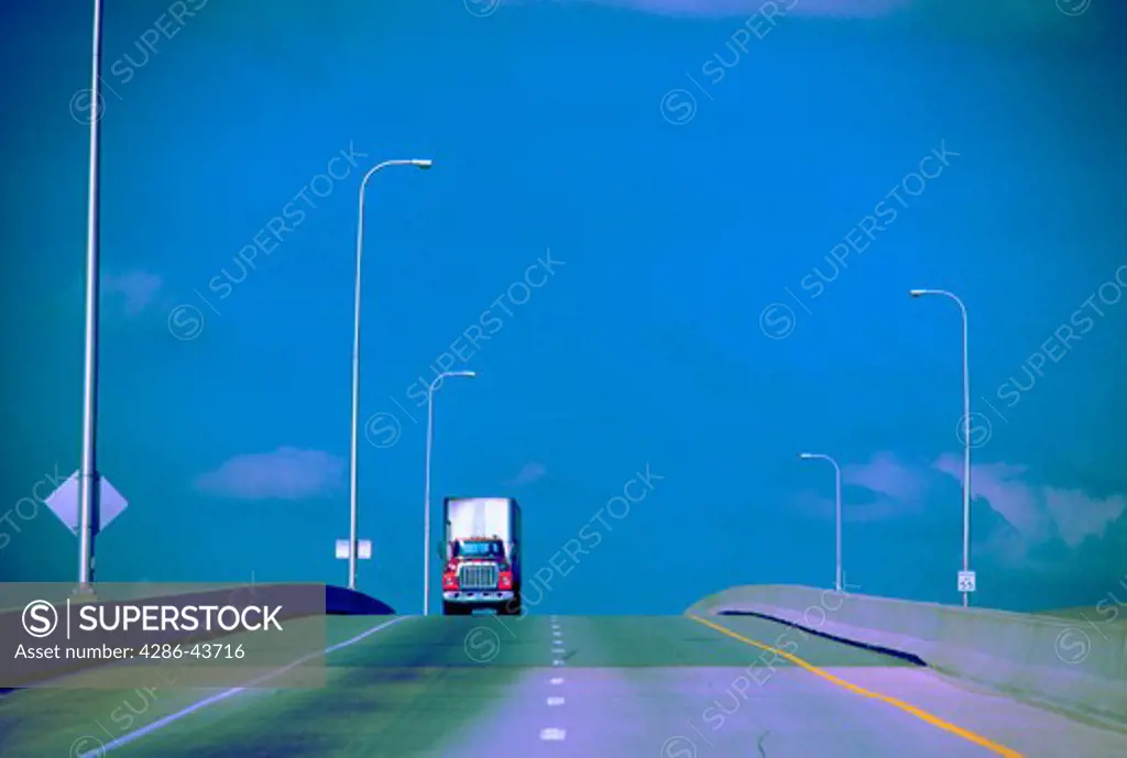 Truck traveling on highway.