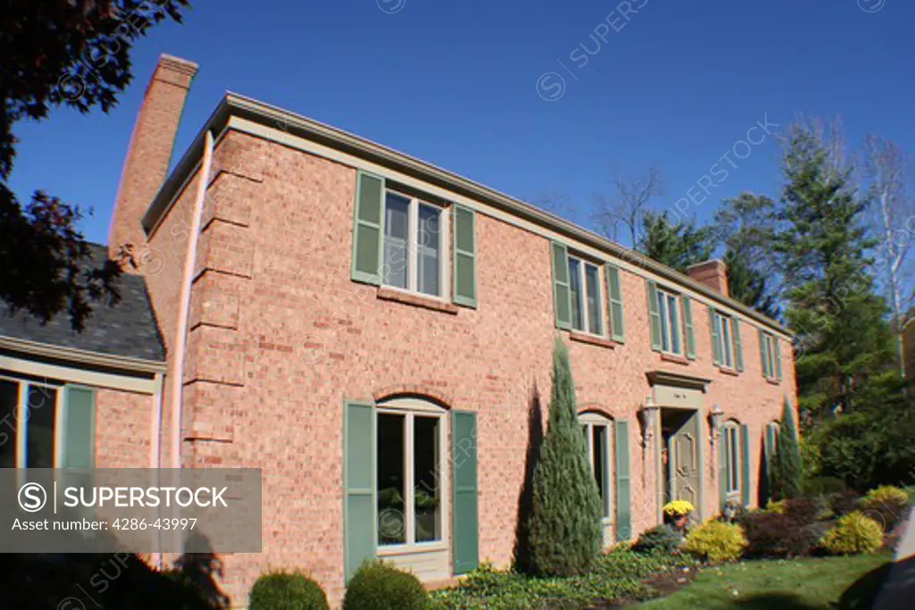 Brick home in upscale neighborhood, wide angle shot