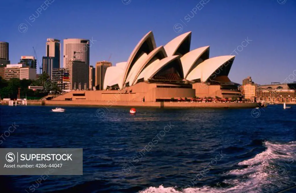 WATERFRONT VIEW OF OPERA HOUSE IN SYDNEY AUSTRALIA