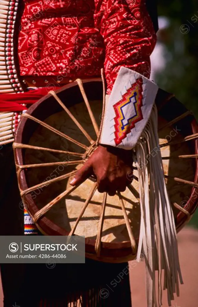 AMERICAN INDIAN'S HAND HOLDING A TRIBAL DRUM