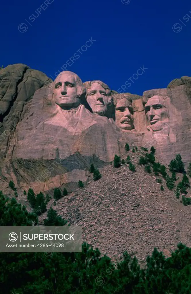 Mt. Rushmore National Memorial.  The faces of presidents George Washington, Thomas Jefferson, Theodore Roosevelt, and Abraham Lincoln were carved on the granite peak by sculptor Gutzon Borglum.