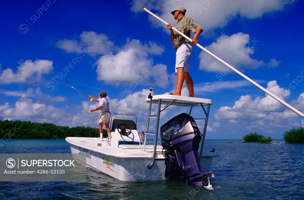 Two men fly fishing in the Florida keys, Islamorada, Florida.