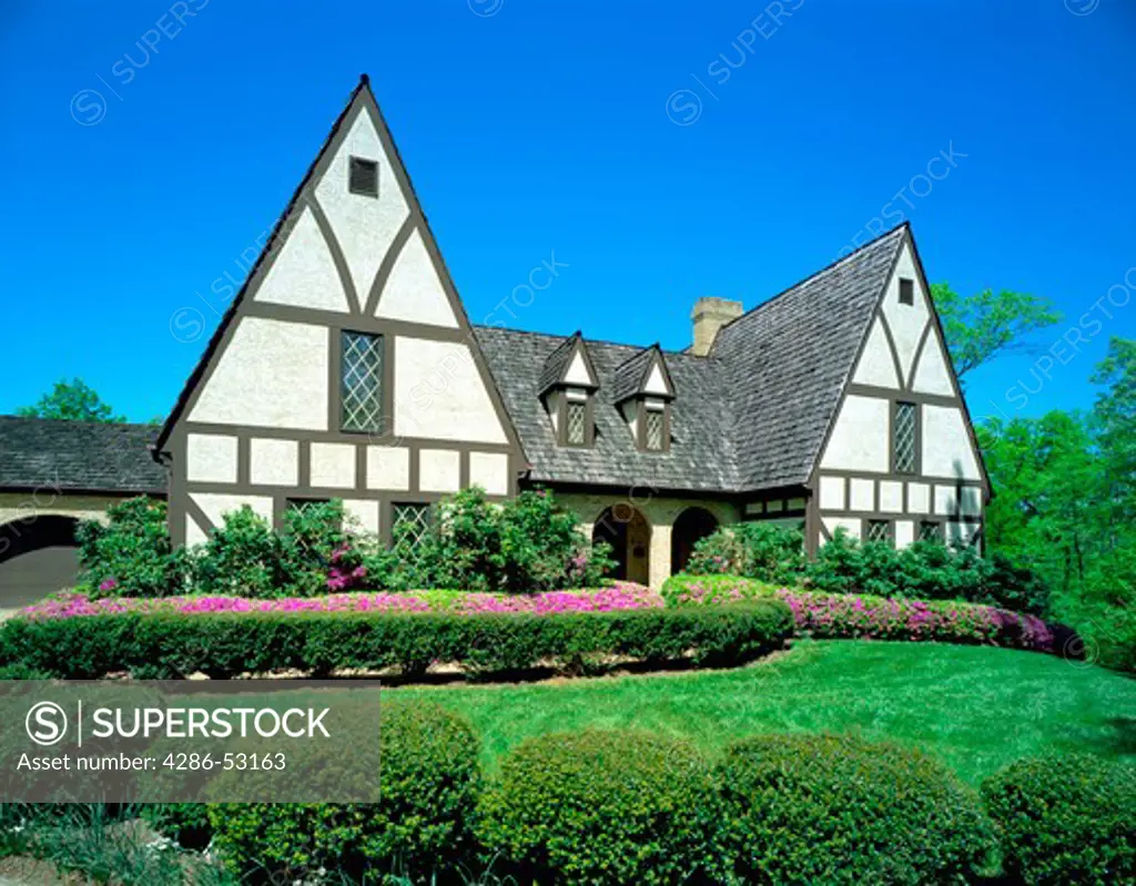 Exterior view of front of Tudor style two story house. Property released.