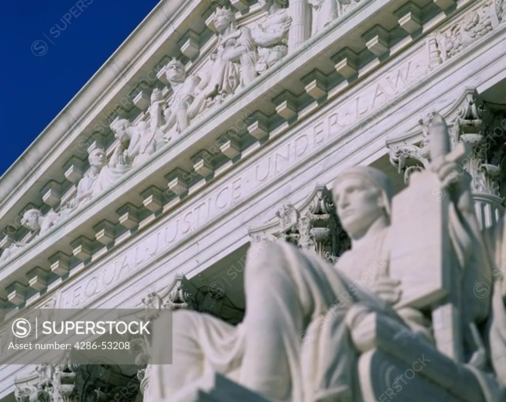 A statue of justice sits outside the front of the Supreme Court building in Washington, D.C.