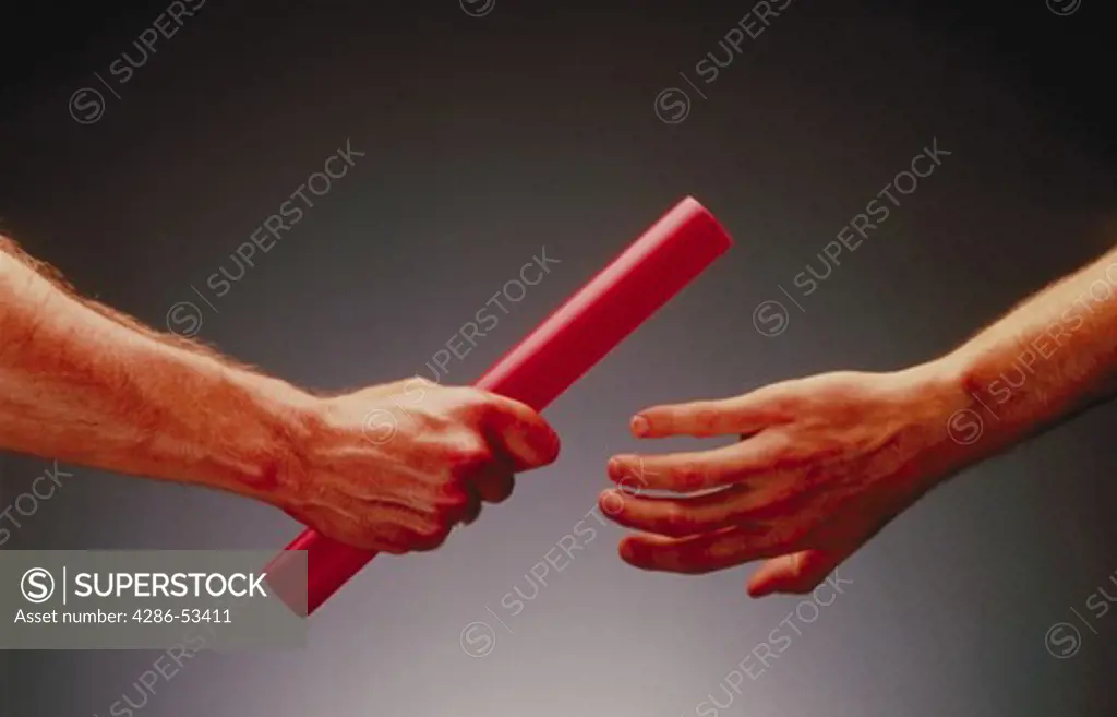 Hands passing the baton