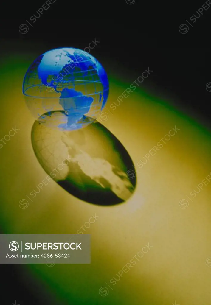 Blue globe with long shadow on gold background