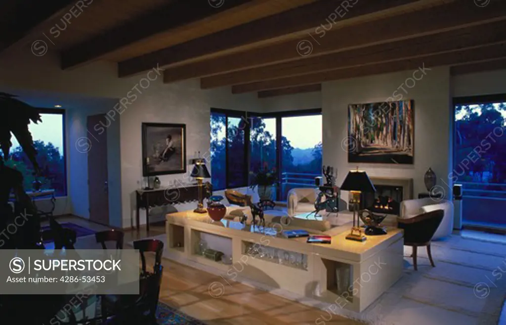 Interior view of post-modern living room with fireplace.  Property released.