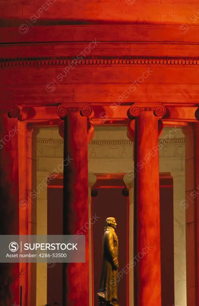Statue of Thomas Jefferson seen through columns surrounding the Jefferson Memorial, Washington, DC.