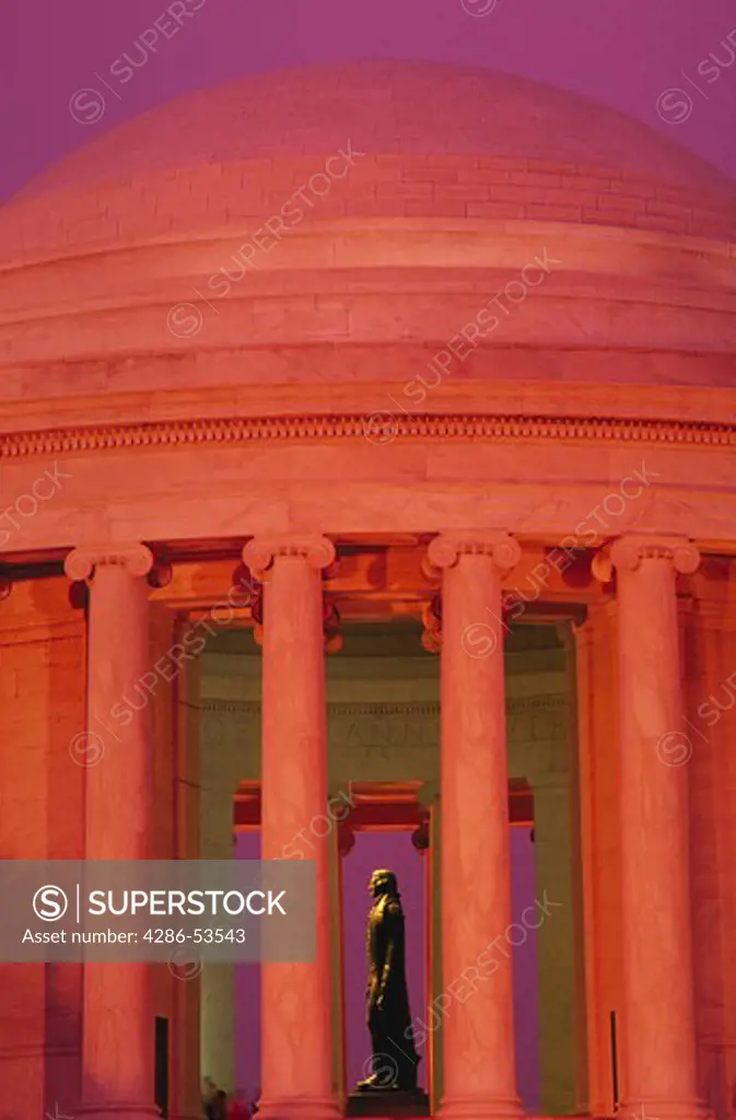 Statue of Thomas Jefferson seen through columns surrounding the Jefferson Memorial, Washington, DC.
