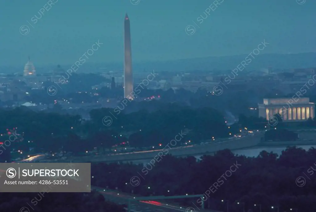 View of the Lincoln Memorial, the Washington Monument and the U.S. Capitol within the foggy Washington, DC skyline.