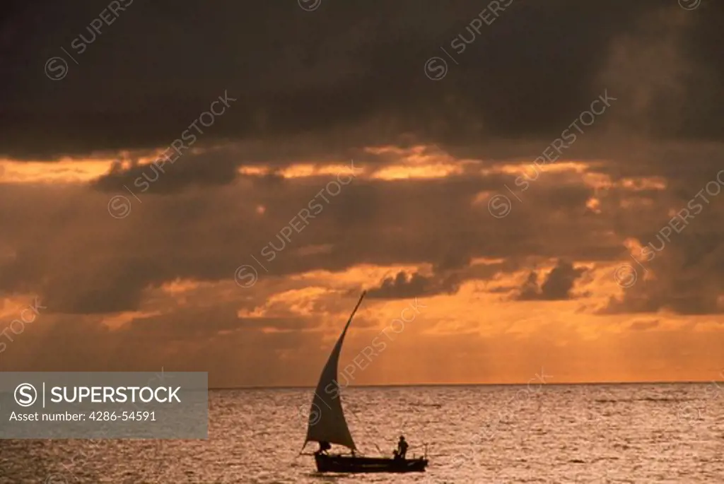 Sailboat at sunset; Maui, Hawaii