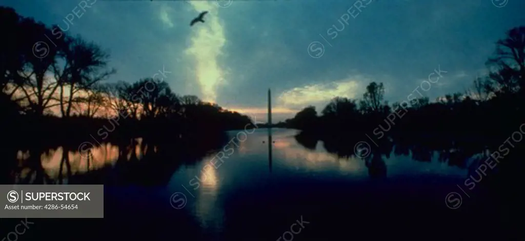 The Washington Monument and reflecting pool in early morning light.  Other monuments, US Capital, available in mood lighting.