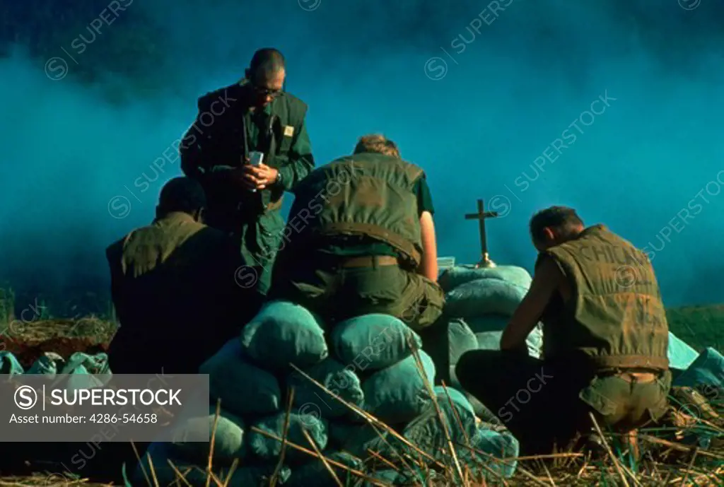 Chaplain holds Sunday morning services on Khe Sanh.  Extensive color and B&W files are available for Vietnam - 1966 through 1975.  Color files available from 1994 also.