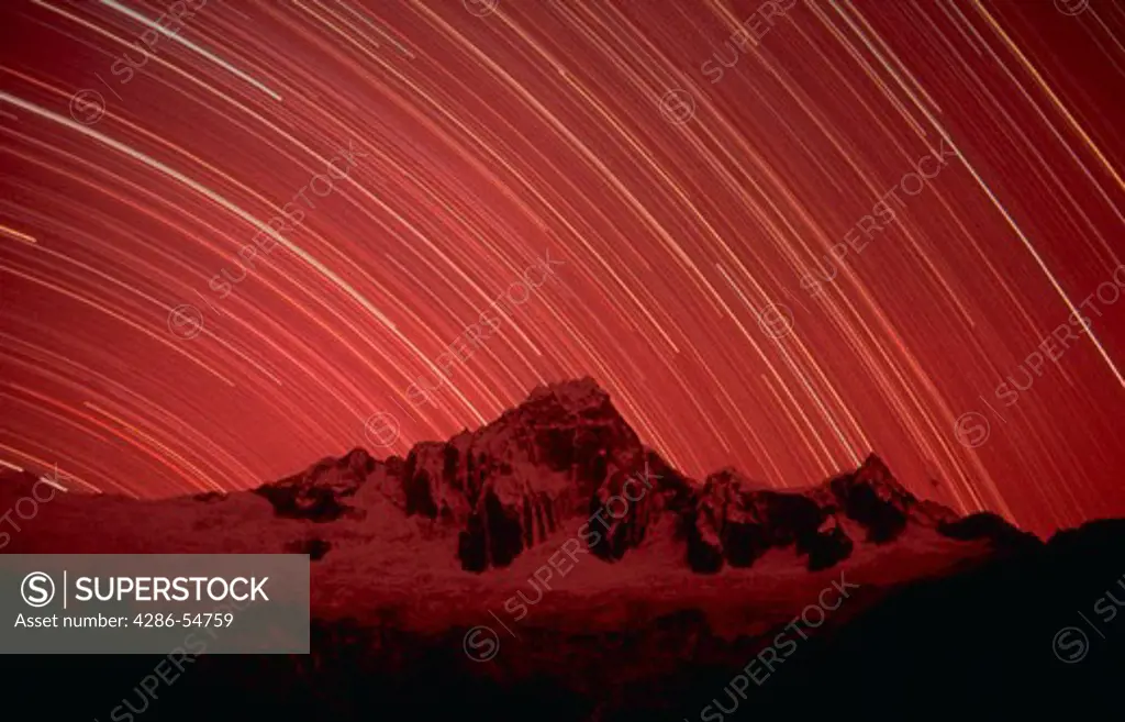 Time exposure shows star trails over 19,128-foot Mount Taulliraju in the Cordillera Blanca mountain range in the Peruvian Andes.