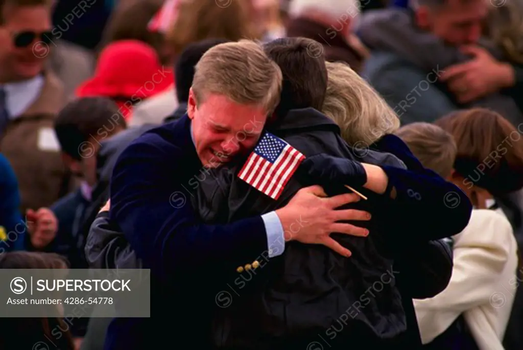 Gulf War ex-POW Colonel David Eberly is embraced by his son Timm, left, upon arrival at Andrews Air Force Base, Maryland.