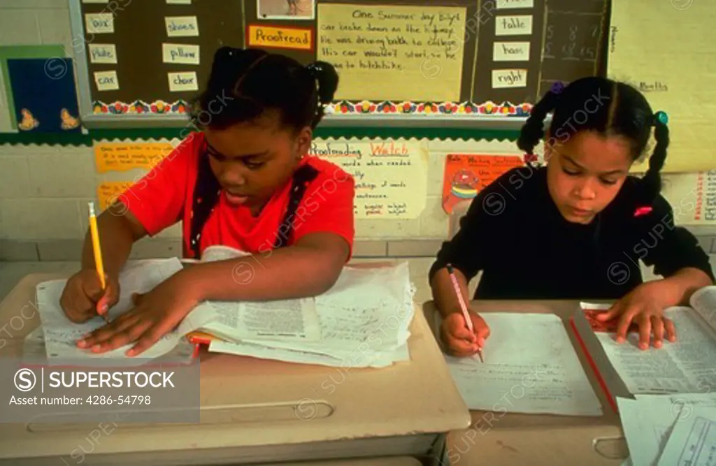 Two second grade girls at work in a single-sex class at the Robert W. Coleman Elementary School in Baltimore, Maryland. Administrators believe the all-girl and all-boy classes provide a less distracting learning environment.