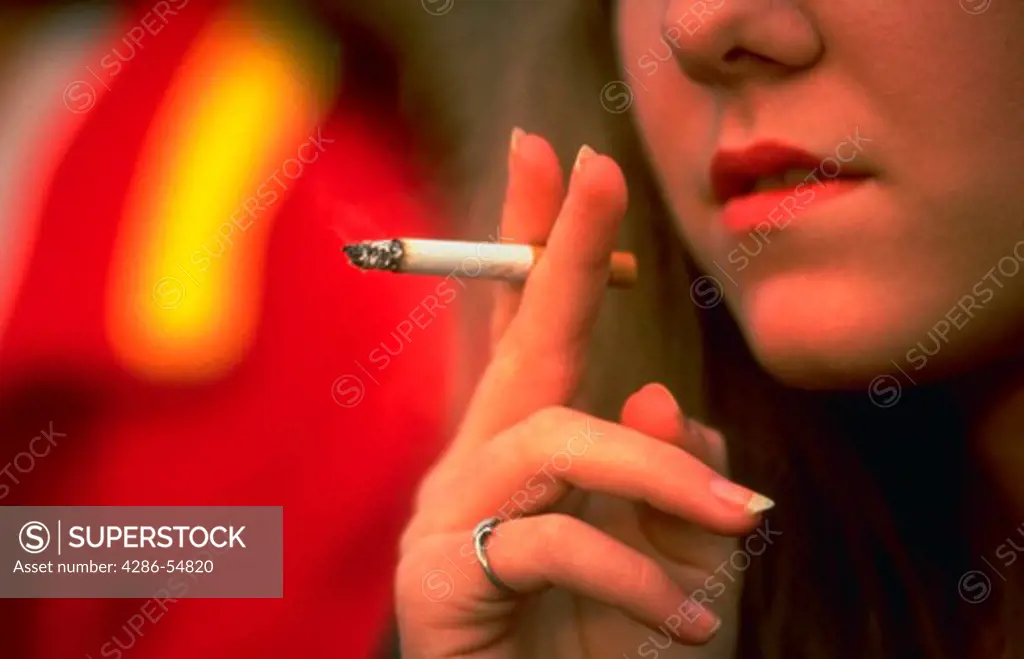 Teen-age girl smoking cigarette in Springfield, Virginia.
