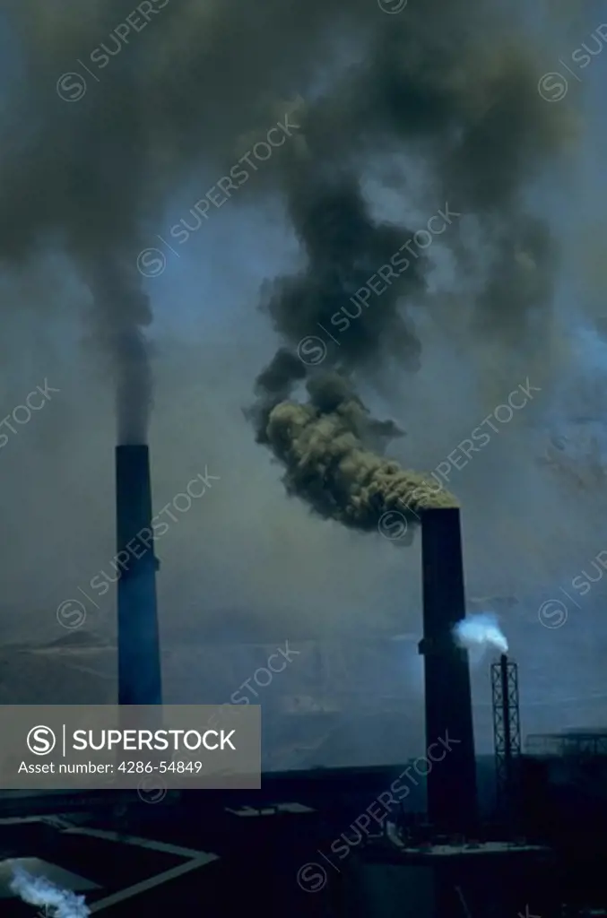 Smokestacks spew pollution from the smelters at the Chuquicamata Copper Mine in Calama, northern Chile. Chuquicamata is the world's largest open pit mine and is located in the Atacama desert.