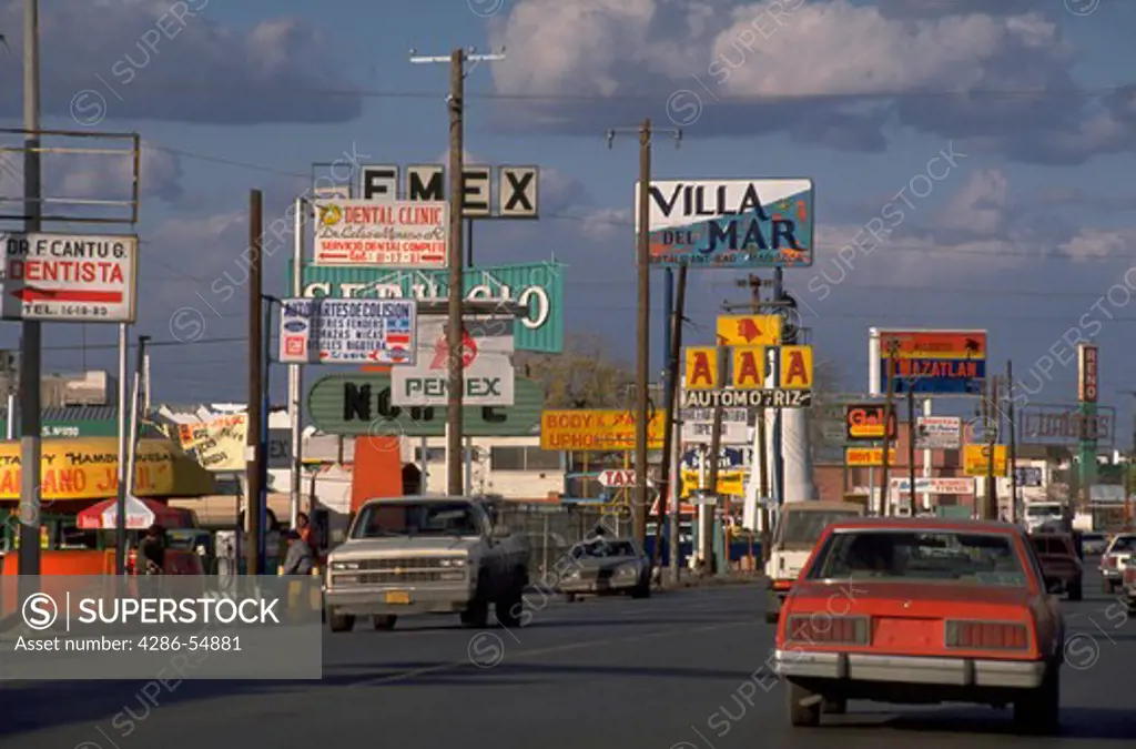 Billboards and traffic on Avenida de las Americas in the border city of Ciudad Juarez, Mexico.