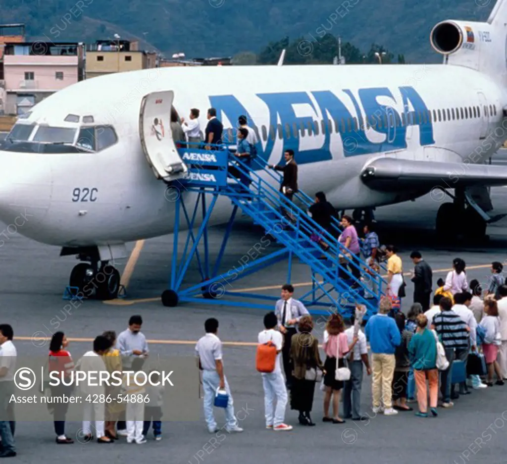 Passengers line up to board an Avensa jetliner at Merida Airport, Merida State, in the Venezuelan Andes.