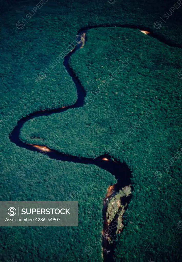 Aerial view of the Churun River as it meanders through dense rain forest in Canaima National Park, Venezuela.