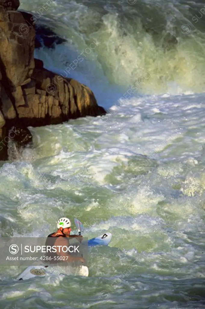 Kayaker in white water of Potomac River in Great Falls National Park, Virginia.