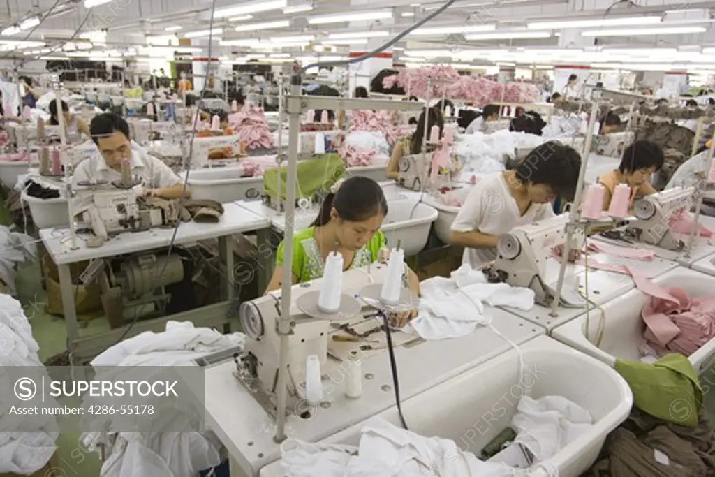 SHENZHEN, GUANGDONG PROVINCE, CHINA - Workers in a garment factory in city of Shenzhen, one of mainland China's first Special Economic Zones, SEZ.