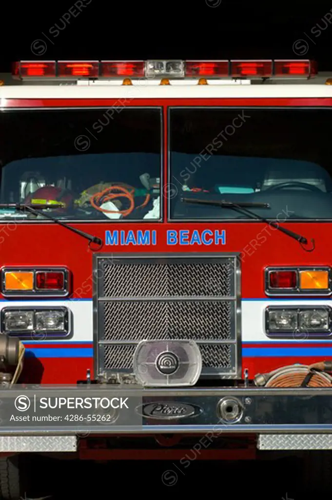 MIAMI BEACH, FLORIDA, USA - Front of red fire truck in garage, South Beach.