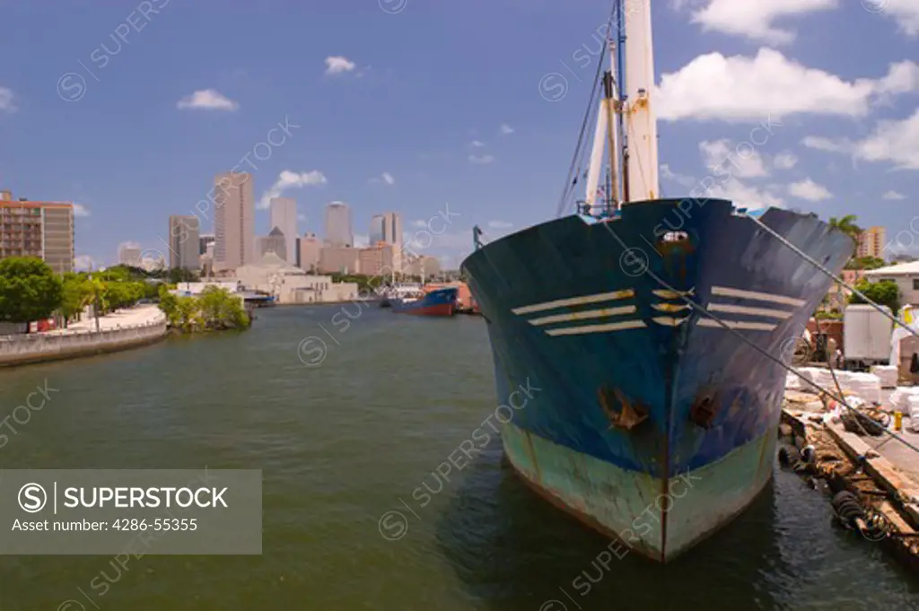 MIAMI, FLORIDA, USA - Miami River, with ships and downtown skyline at rear.