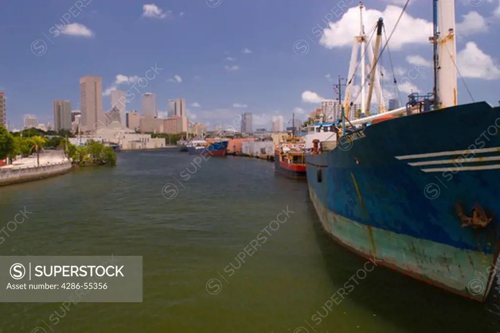 MIAMI, FLORIDA, USA - Miami River, with ships and downtown skyline at rear.