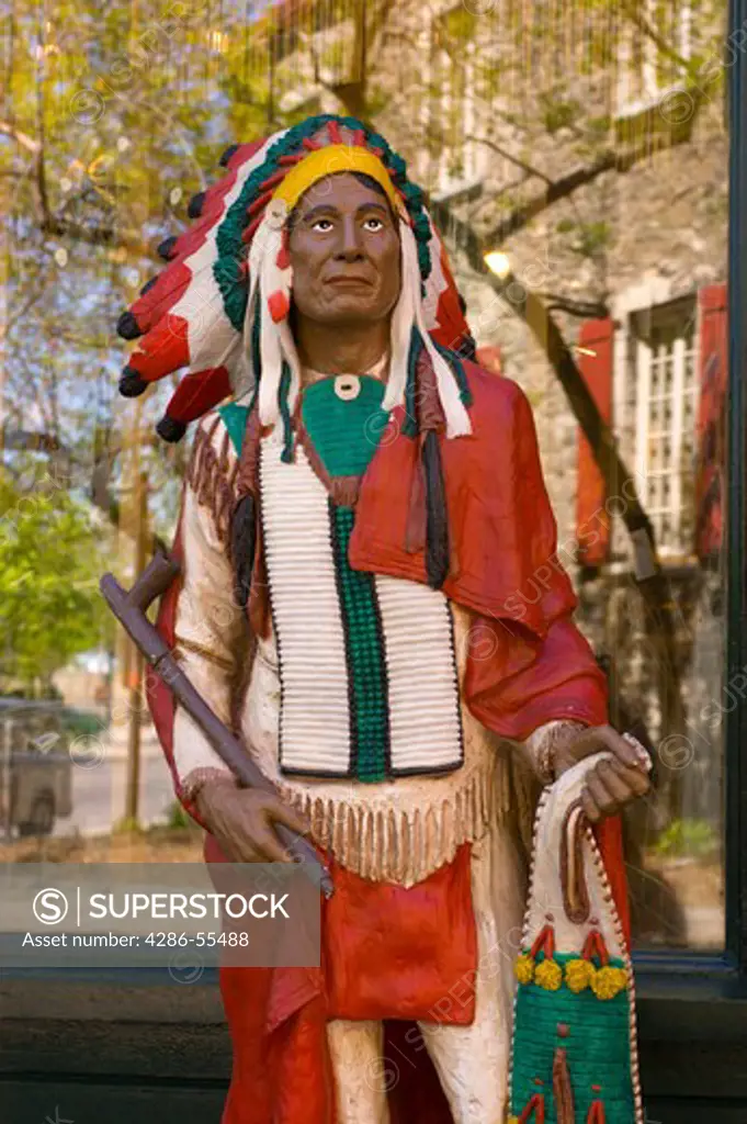 QUEBEC CITY, QUEBEC, CANADA - Statue of native american indian on street.