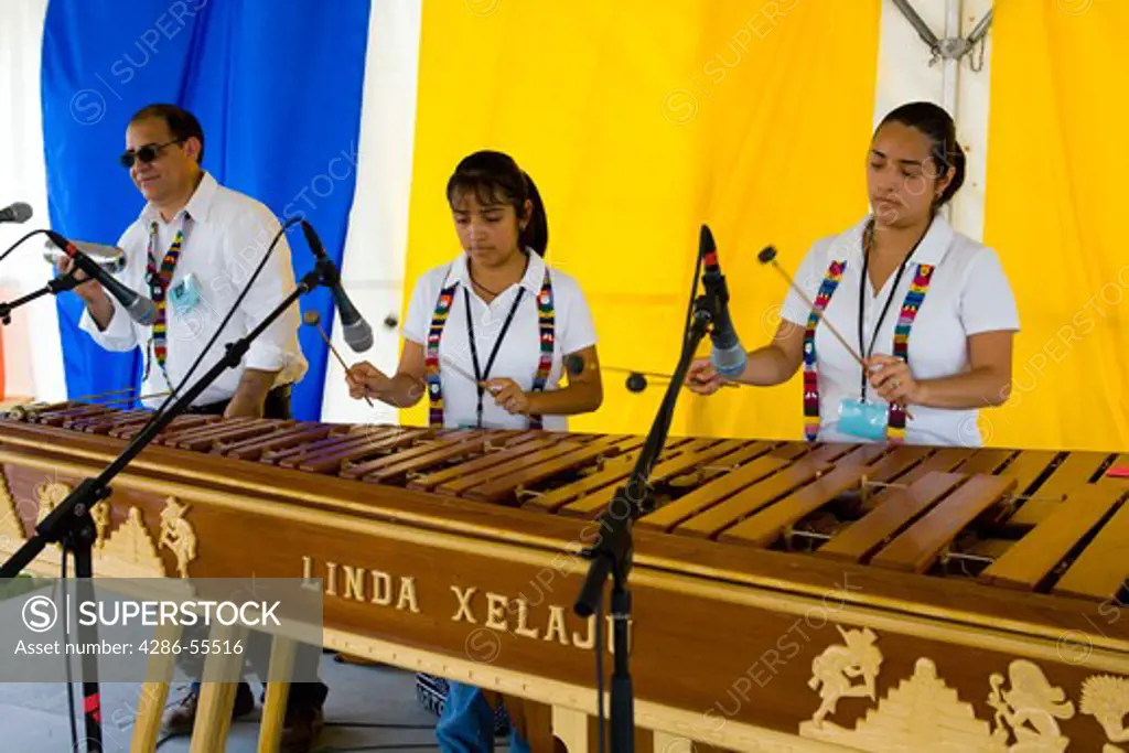 WASHINGTON, DC, USA - Marimba Linda Xelaj£ band, from Silver Spring, Maryland, performs at the Smithsonian Folklife Festival. The Gir¢n family (father and daughters) play the Guatemala marimba.