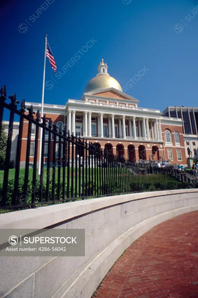 Gold-domed Massachusetts State Capitol building in Boston on a sunny day.